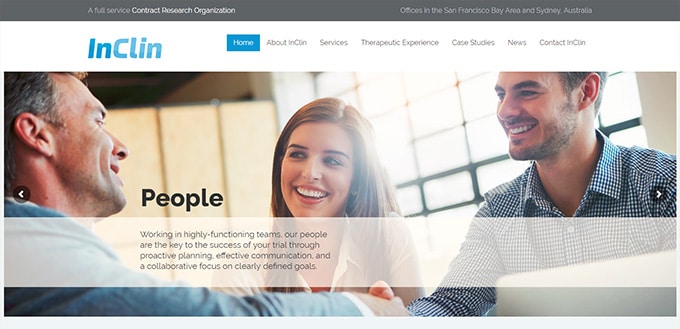 Three people smiling and talking in a modern InClin office under the People section.