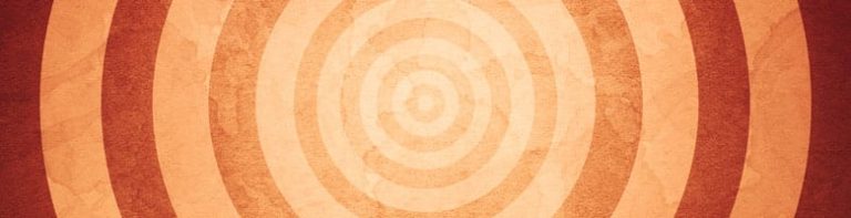 Retro-style concentric circles in shades of orange, creating a vintage target pattern.